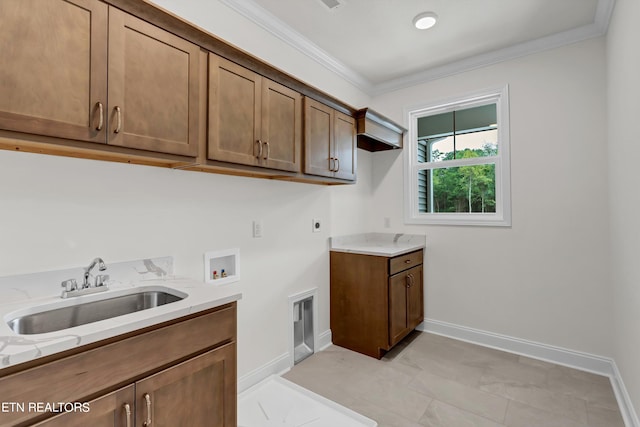 clothes washing area featuring hookup for a washing machine, cabinets, ornamental molding, sink, and electric dryer hookup