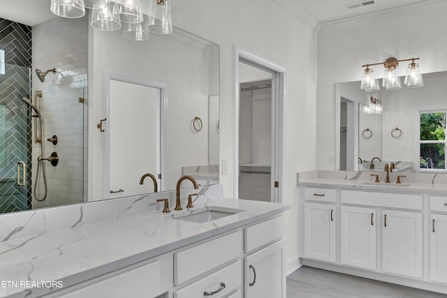 bathroom with an enclosed shower, ornamental molding, and vanity