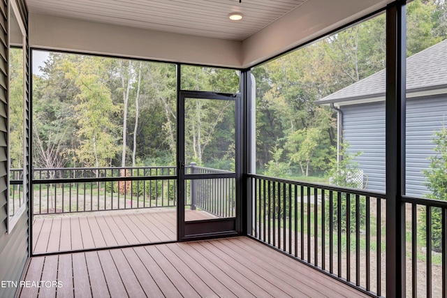 unfurnished sunroom featuring a wealth of natural light