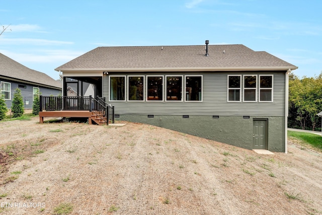 rear view of property with a deck