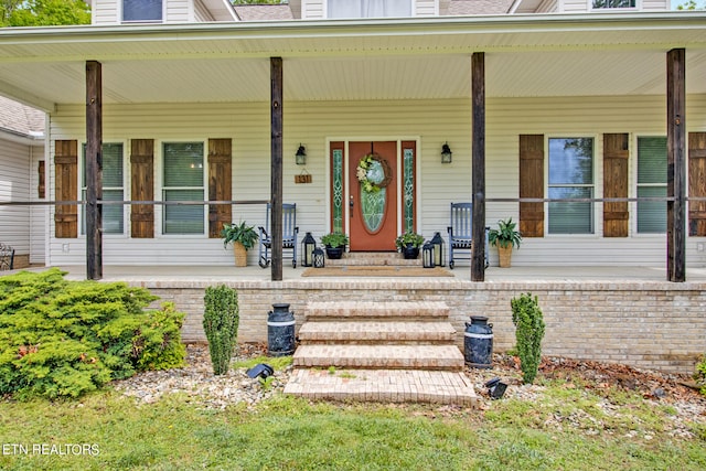 property entrance featuring covered porch