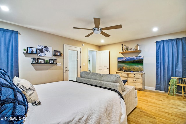 bedroom featuring ceiling fan and hardwood / wood-style flooring