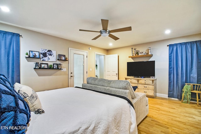 bedroom with wood-type flooring and ceiling fan