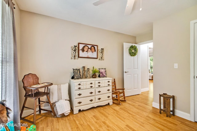 sitting room featuring ceiling fan and light hardwood / wood-style floors