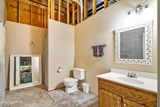 bathroom featuring oversized vanity and toilet