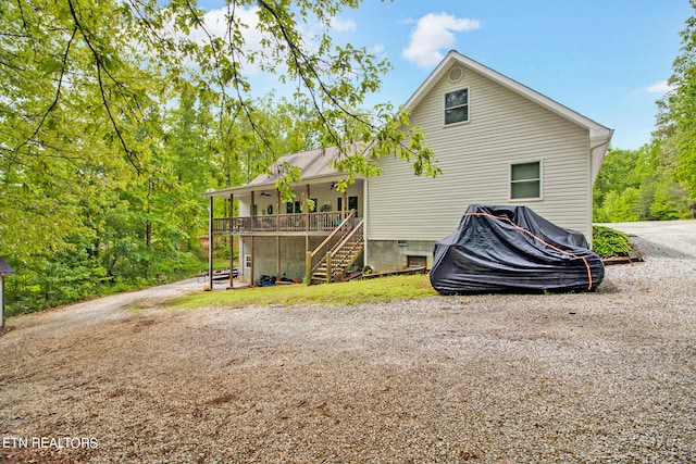 back of property with a porch