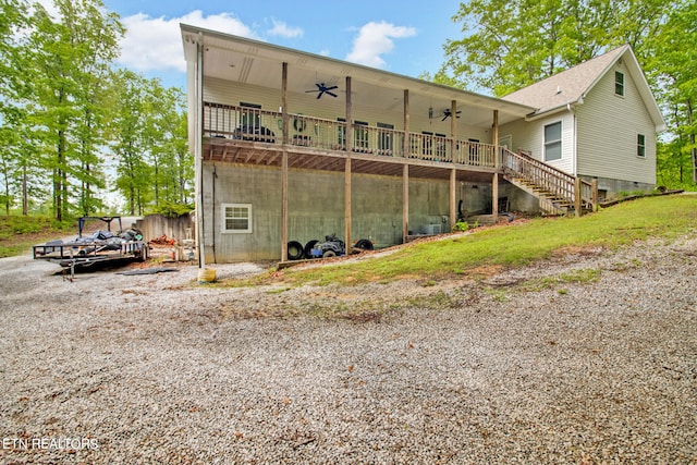 back of house featuring ceiling fan