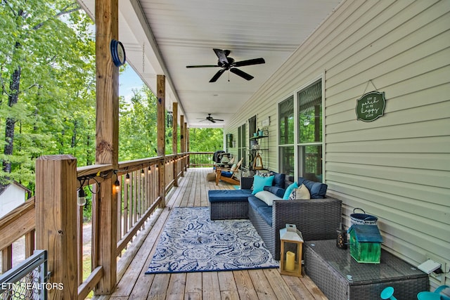 wooden deck featuring ceiling fan and an outdoor hangout area