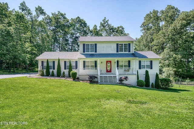 view of front of home with a front lawn and covered porch