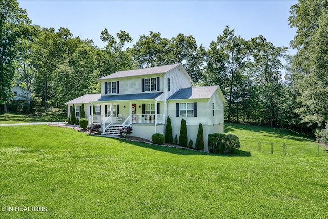 view of front of home featuring a front yard and a porch