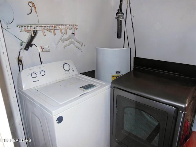 washroom featuring washing machine and dryer