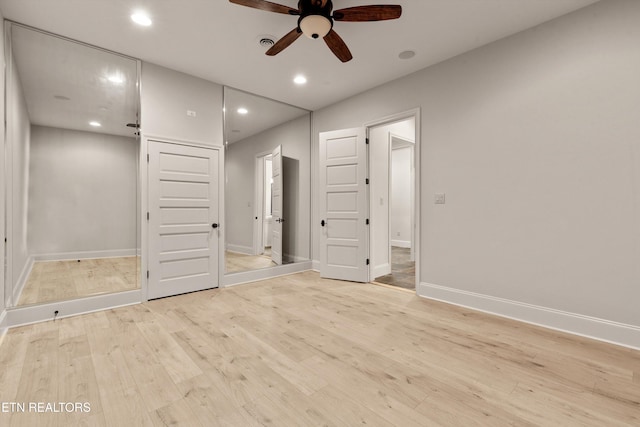 unfurnished bedroom featuring light hardwood / wood-style floors and ceiling fan