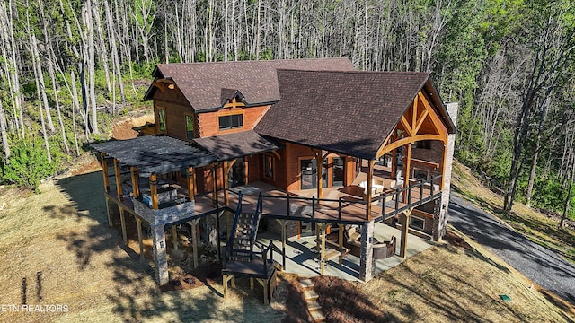 rear view of property with a patio area and a deck