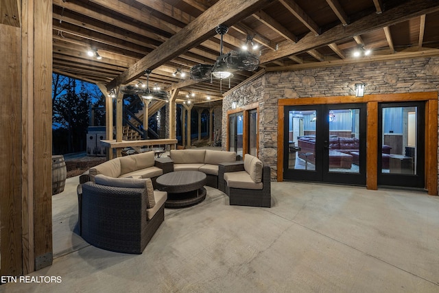 interior space with concrete floors and beamed ceiling