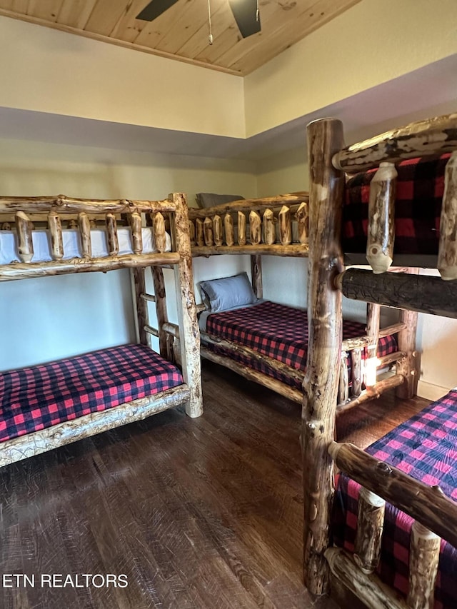 bedroom with ceiling fan, hardwood / wood-style floors, and wooden ceiling