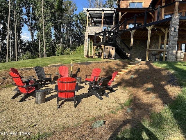 view of yard with an outdoor fire pit