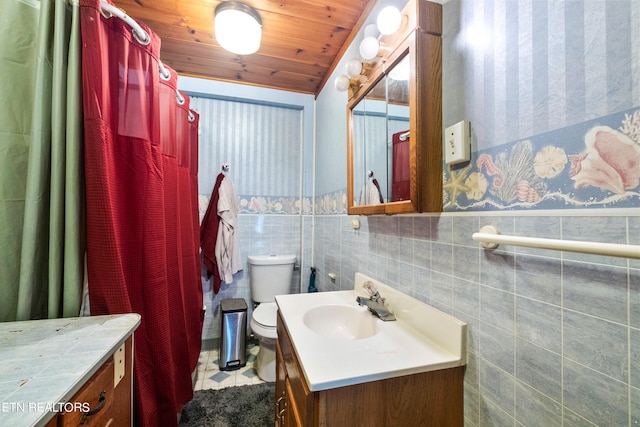 bathroom featuring vanity with extensive cabinet space, toilet, tile walls, and wood ceiling