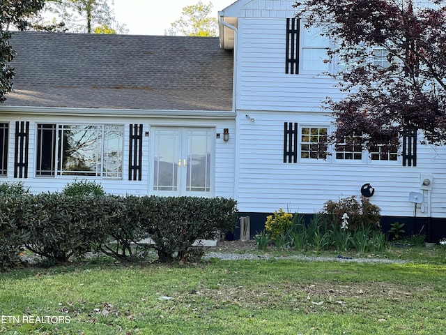 view of property exterior featuring a lawn