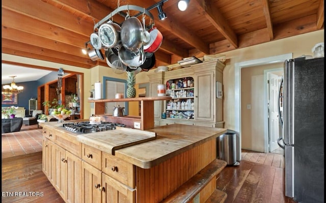 kitchen featuring wooden ceiling, stainless steel appliances, an inviting chandelier, and dark wood-type flooring