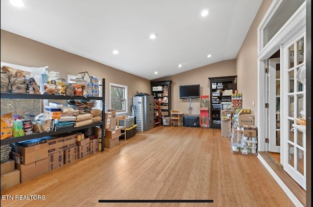 office area with lofted ceiling, french doors, and light wood-type flooring