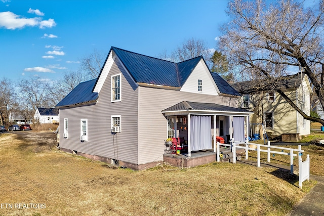 view of front of property with a front yard and covered porch