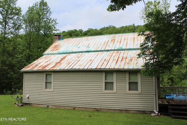 view of property exterior featuring a yard