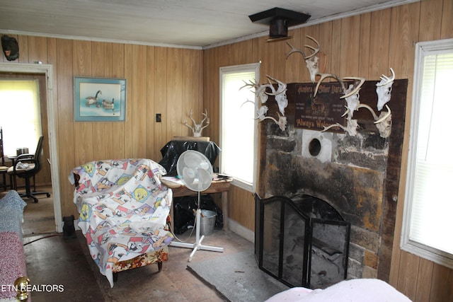 living room with wood walls and a healthy amount of sunlight