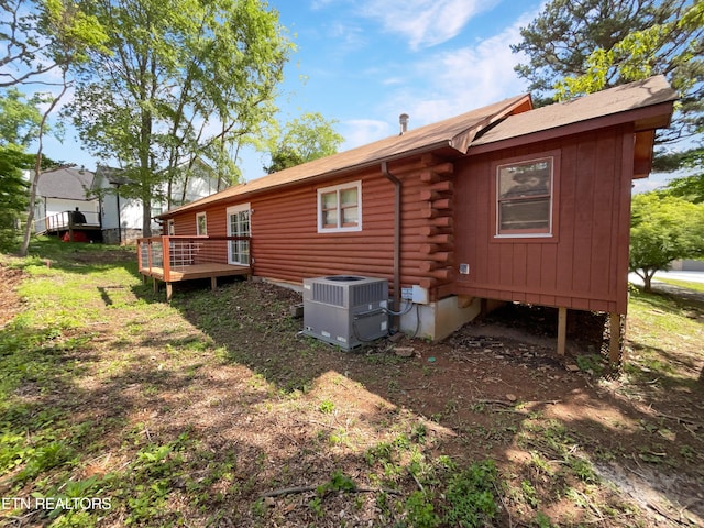 back of property featuring central AC and a wooden deck