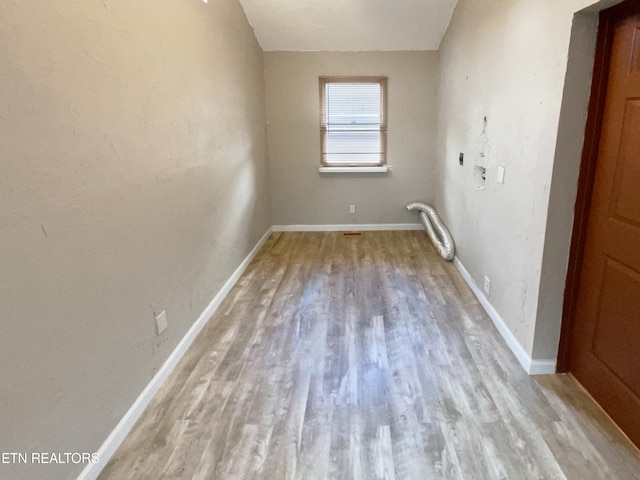 spare room with hardwood / wood-style flooring