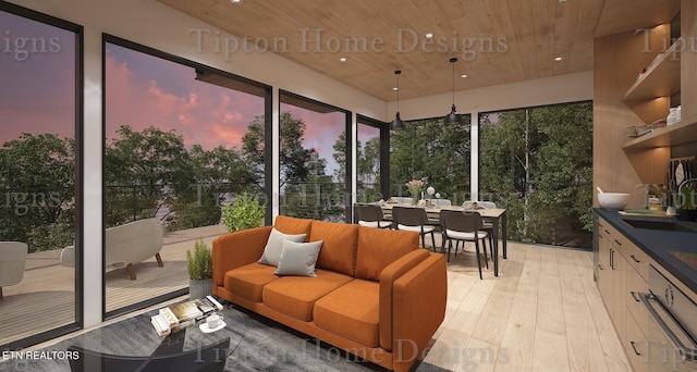 sunroom / solarium featuring wooden ceiling and sink