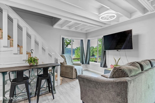 living room with beamed ceiling and hardwood / wood-style flooring