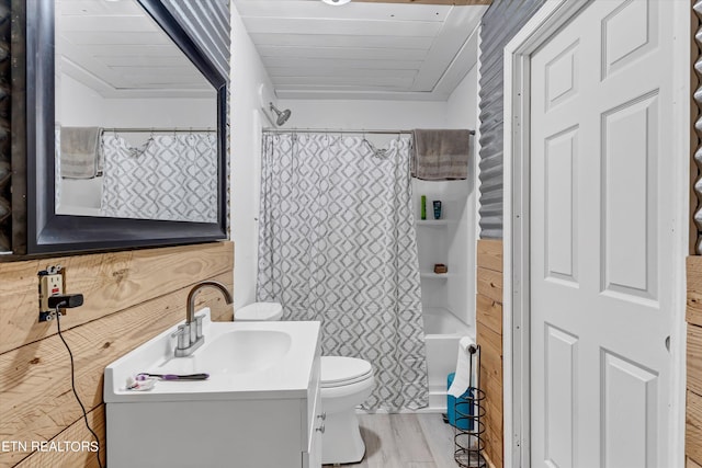 bathroom featuring wooden ceiling, vanity with extensive cabinet space, toilet, and hardwood / wood-style floors