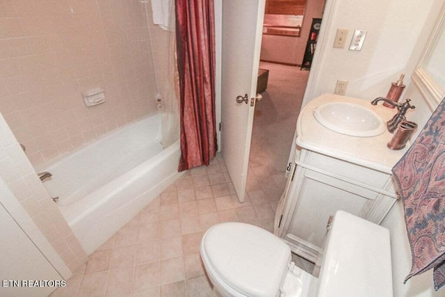 full bathroom featuring tile floors, shower / bath combo, toilet, and vanity