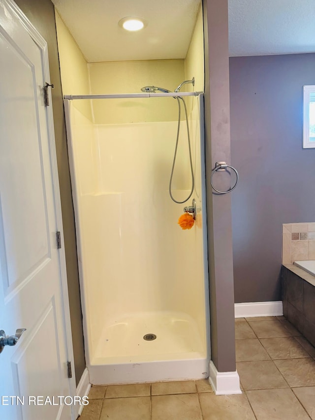 bathroom featuring tile patterned floors and walk in shower