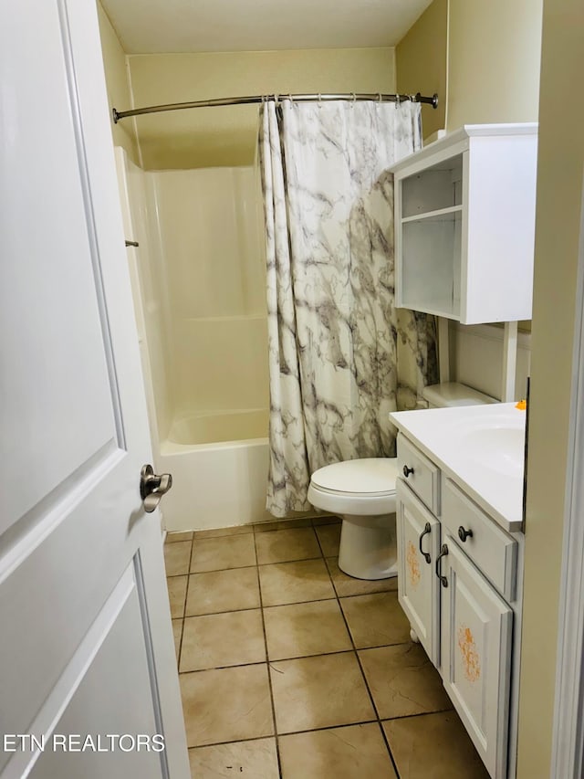 full bathroom featuring tile patterned floors, vanity, toilet, and shower / bath combination with curtain