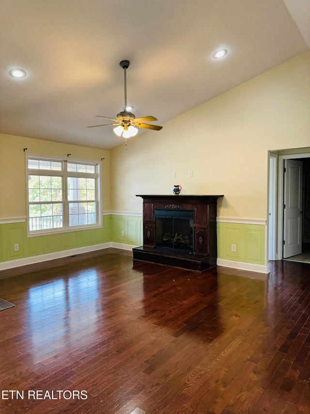 unfurnished living room featuring ceiling fan, dark hardwood / wood-style flooring, and lofted ceiling