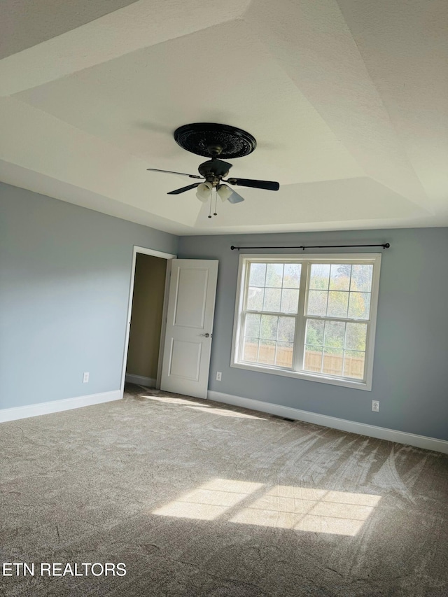 unfurnished bedroom featuring ceiling fan and carpet floors