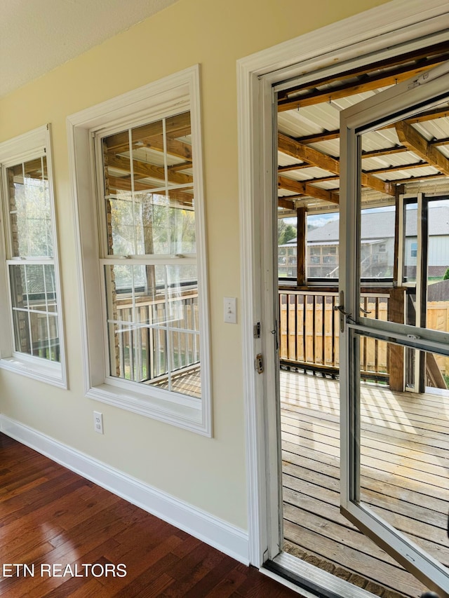 doorway to outside featuring dark hardwood / wood-style flooring