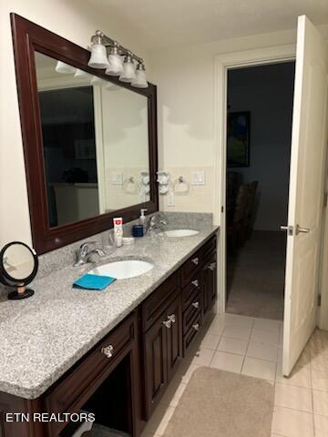 bathroom featuring tile patterned flooring and vanity