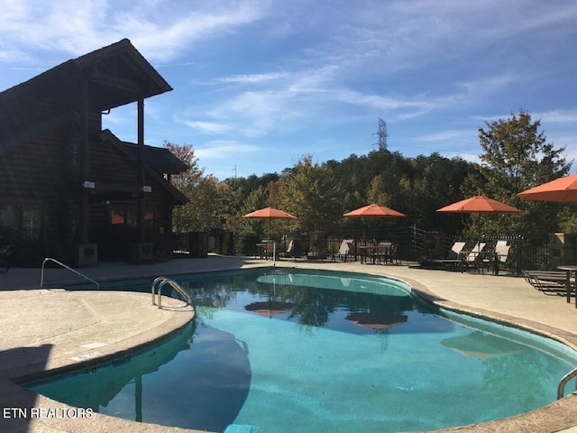 view of swimming pool featuring a patio area