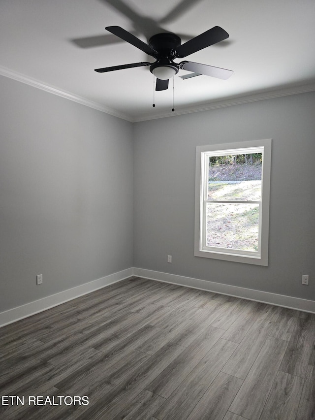 spare room with ornamental molding, ceiling fan, and dark hardwood / wood-style floors