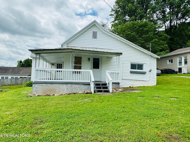 view of front of house with a front lawn and covered porch