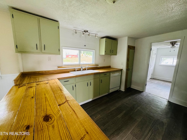 kitchen with sink, butcher block countertops, dishwasher, and ceiling fan