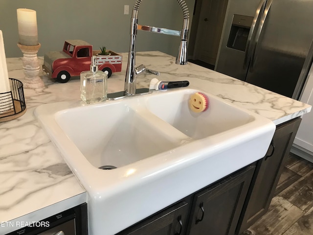 kitchen featuring sink and dark hardwood / wood-style flooring