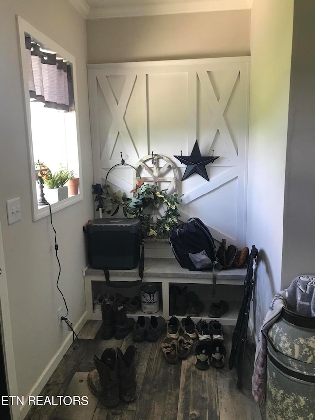 room details with crown molding and hardwood / wood-style flooring