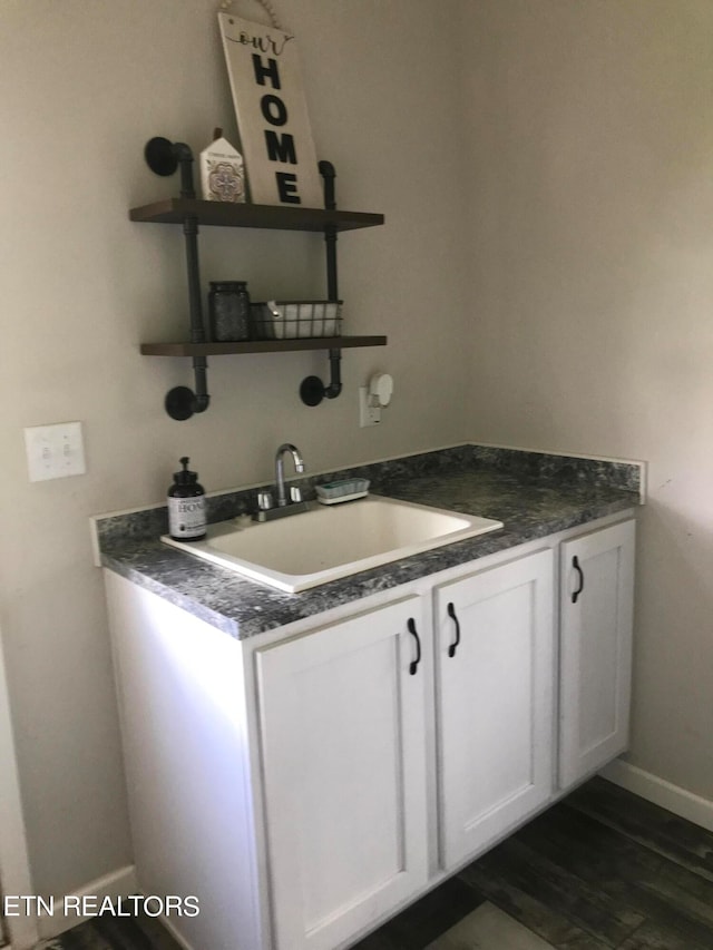 bathroom featuring wood-type flooring and vanity