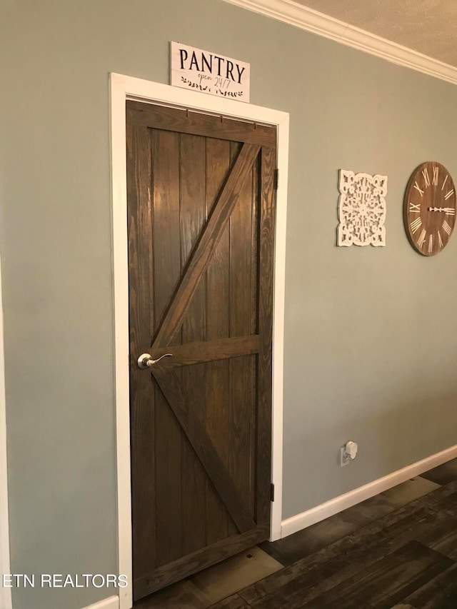 details featuring ornamental molding and hardwood / wood-style floors