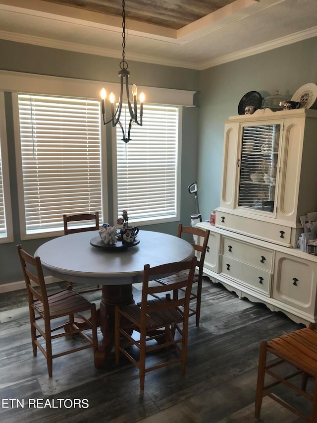 dining space featuring ornamental molding, an inviting chandelier, dark hardwood / wood-style flooring, wooden ceiling, and a raised ceiling