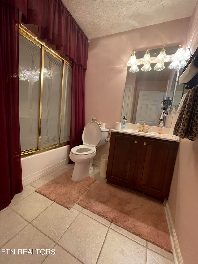 full bathroom featuring tile flooring, a textured ceiling, enclosed tub / shower combo, toilet, and vanity