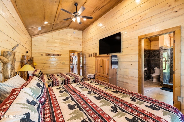 unfurnished bedroom with tile flooring, wooden ceiling, connected bathroom, wood walls, and vaulted ceiling